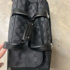 Tumi Black Patterned overnight with roller wheels